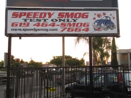 Speedy Smog Test Only roadside sign with phone number